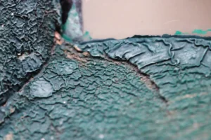Pealing green paint.