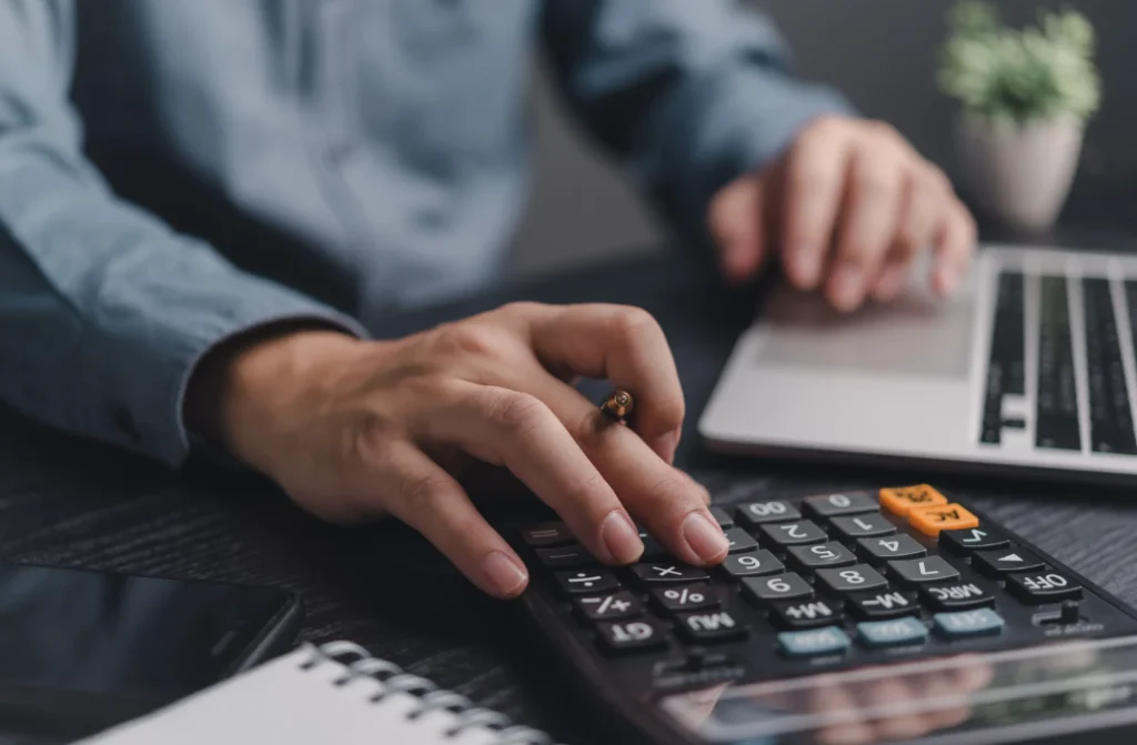 Employee calculating overtime pay.